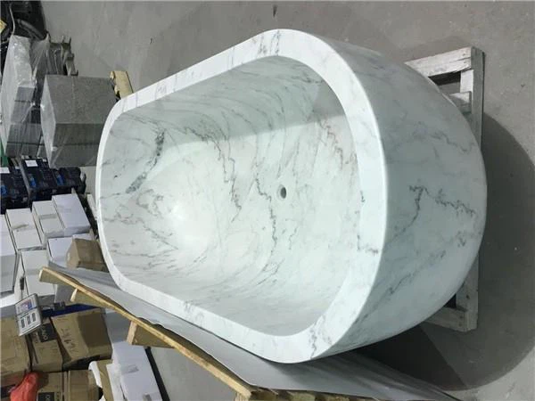 white marble oval bathtub